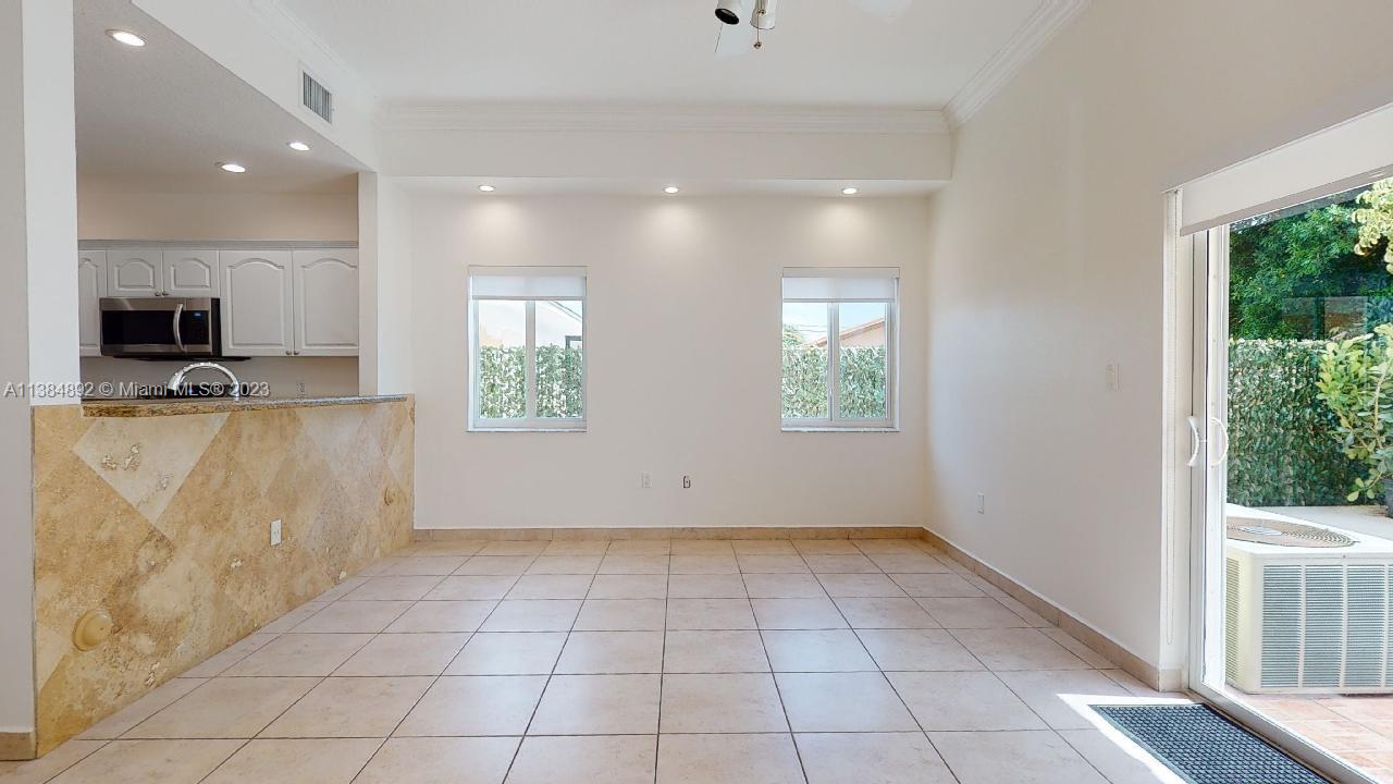 Kirkland Heights Miami, FL 33135 - Photo 5 of 11 a view of a kitchen with a sink and a microwave
