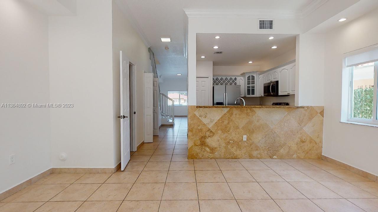 Kirkland Heights Miami, FL 33135 - Photo 6 of 11 a large kitchen with cabinets and a stove