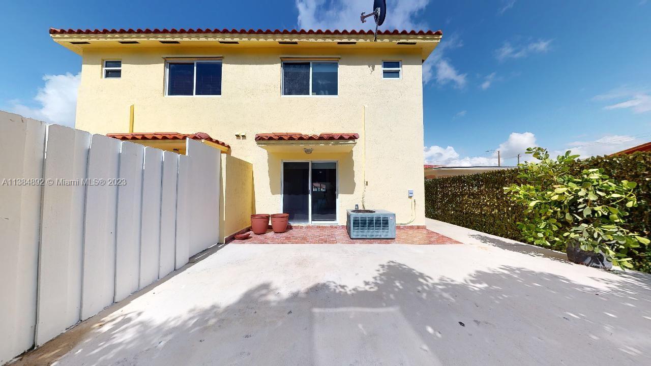 Kirkland Heights Miami, FL 33135 - Photo 7 of 11 a view of a house with a yard and a garage