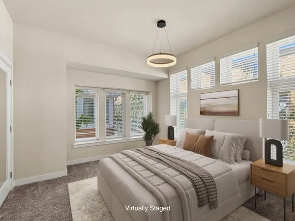 a bedroom with a large bed and a window