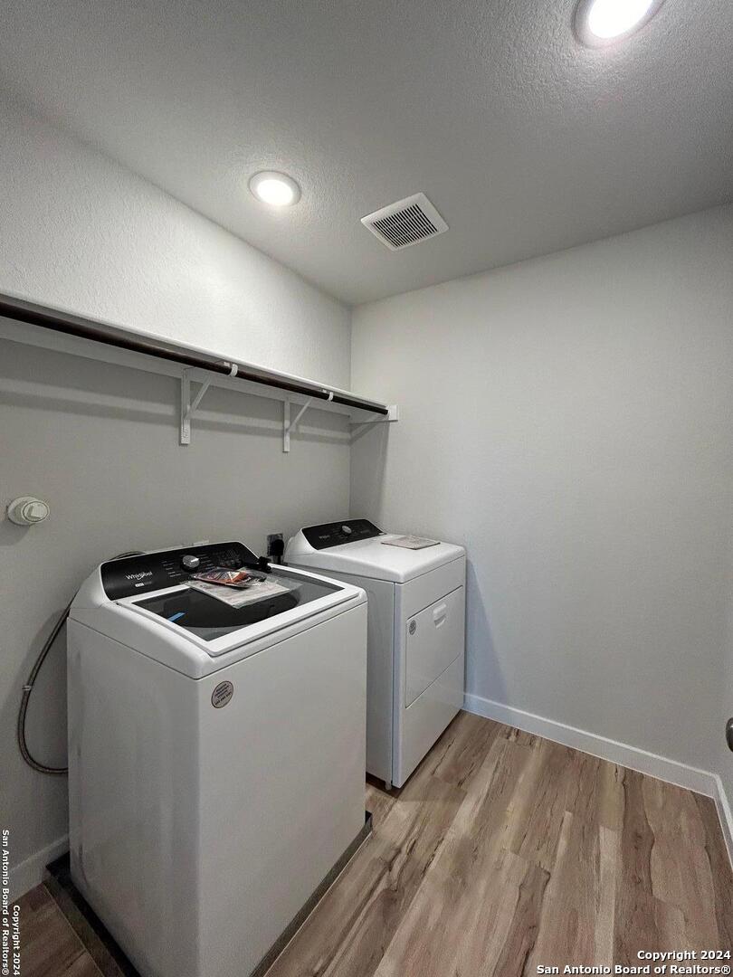 4305 Danforth Street New Braunfels, TX 78130 - Photo 13 of 31 a utility room with dryer and washer