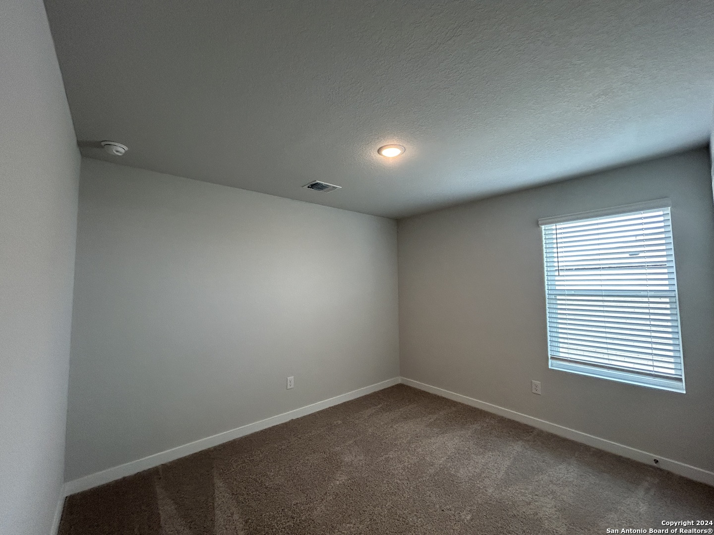 4305 Danforth Street New Braunfels, TX 78130 - Photo 23 of 31 an empty room with a window