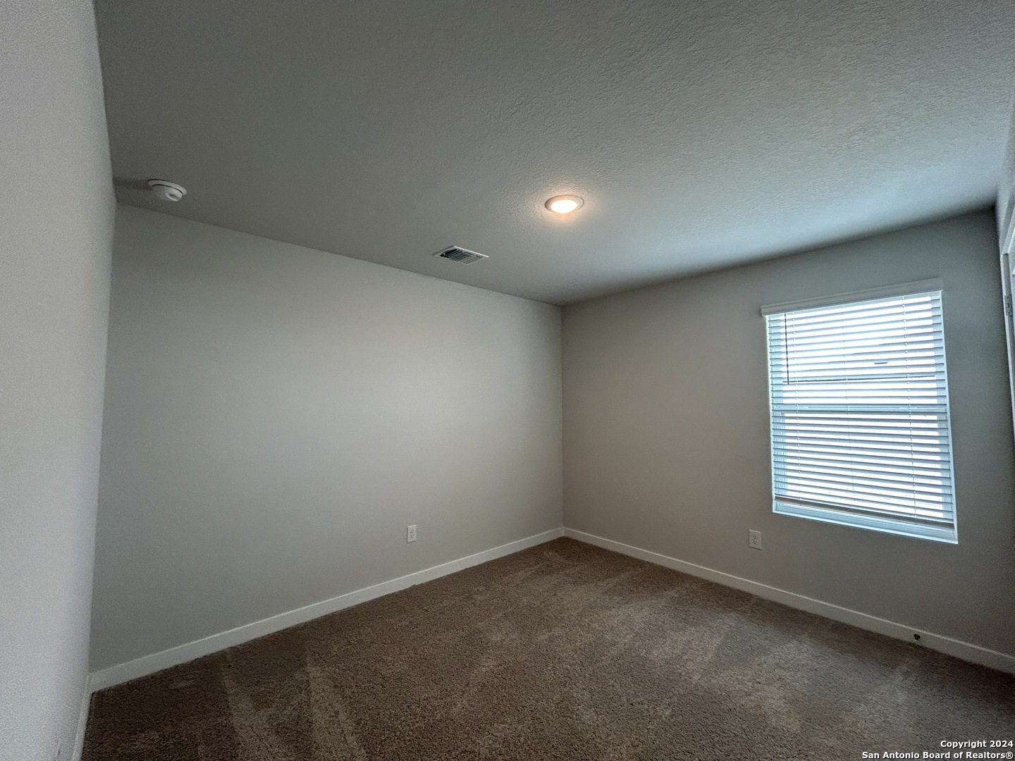 4305 Danforth Street New Braunfels, TX 78130 - Photo 26 of 31 an empty room with a window