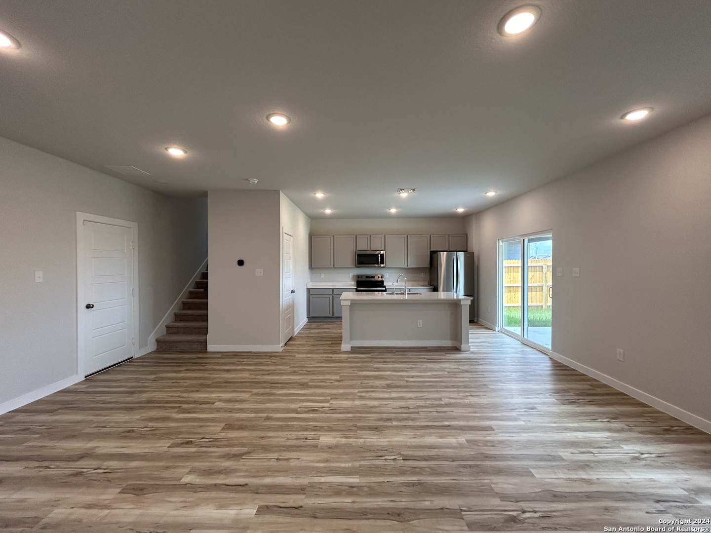 4305 Danforth Street New Braunfels, TX 78130 - Photo 3 of 31 a big room with wooden floor and windows
