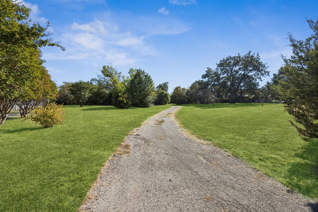 6 North Star Road Lucas, TX 75002 - Photo 2 of 12 a view of a golf course with a garden