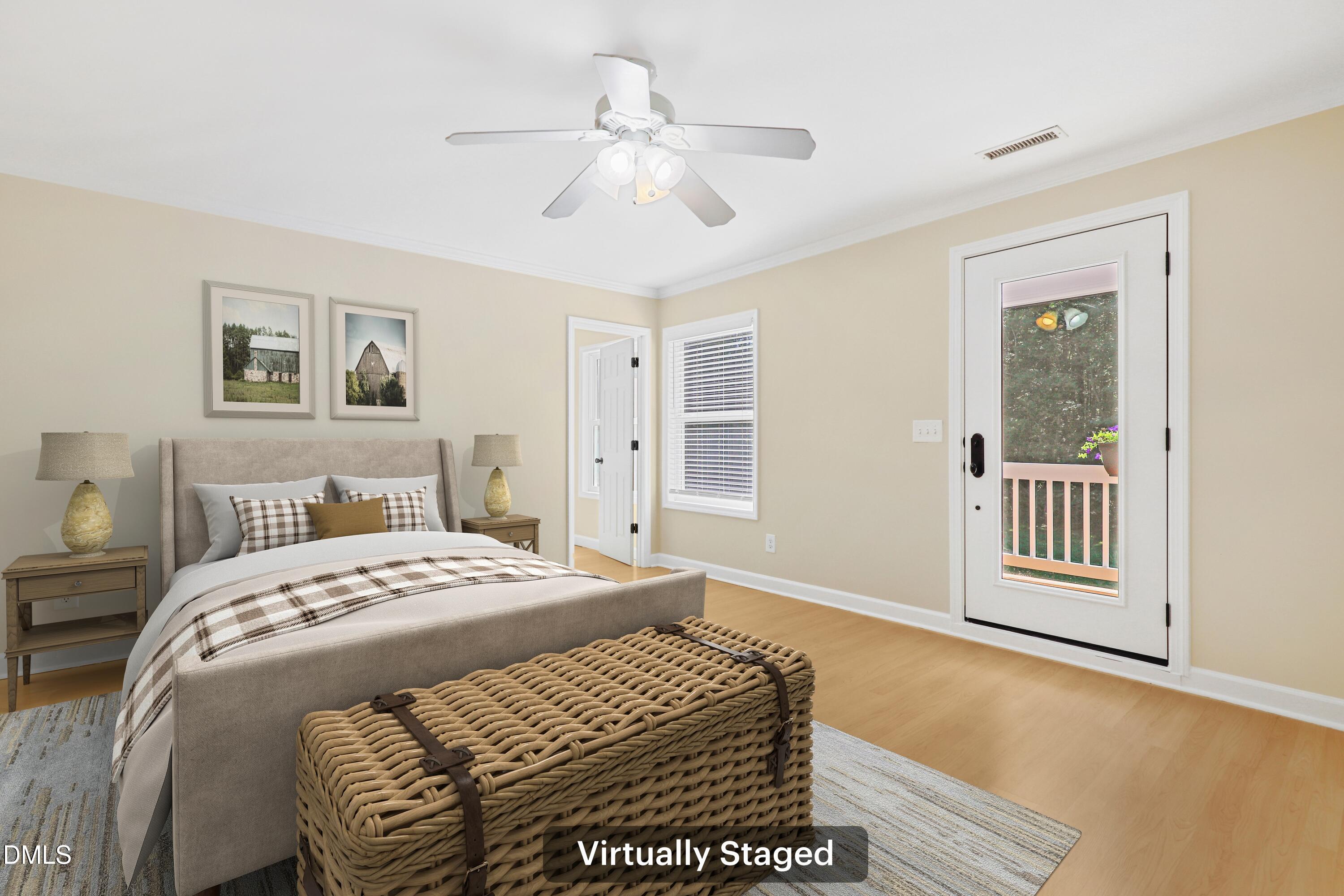 33 Holly Run Pittsboro, NC 27312 - Photo 21 of 46 a bedroom with a large bed and a chandelier