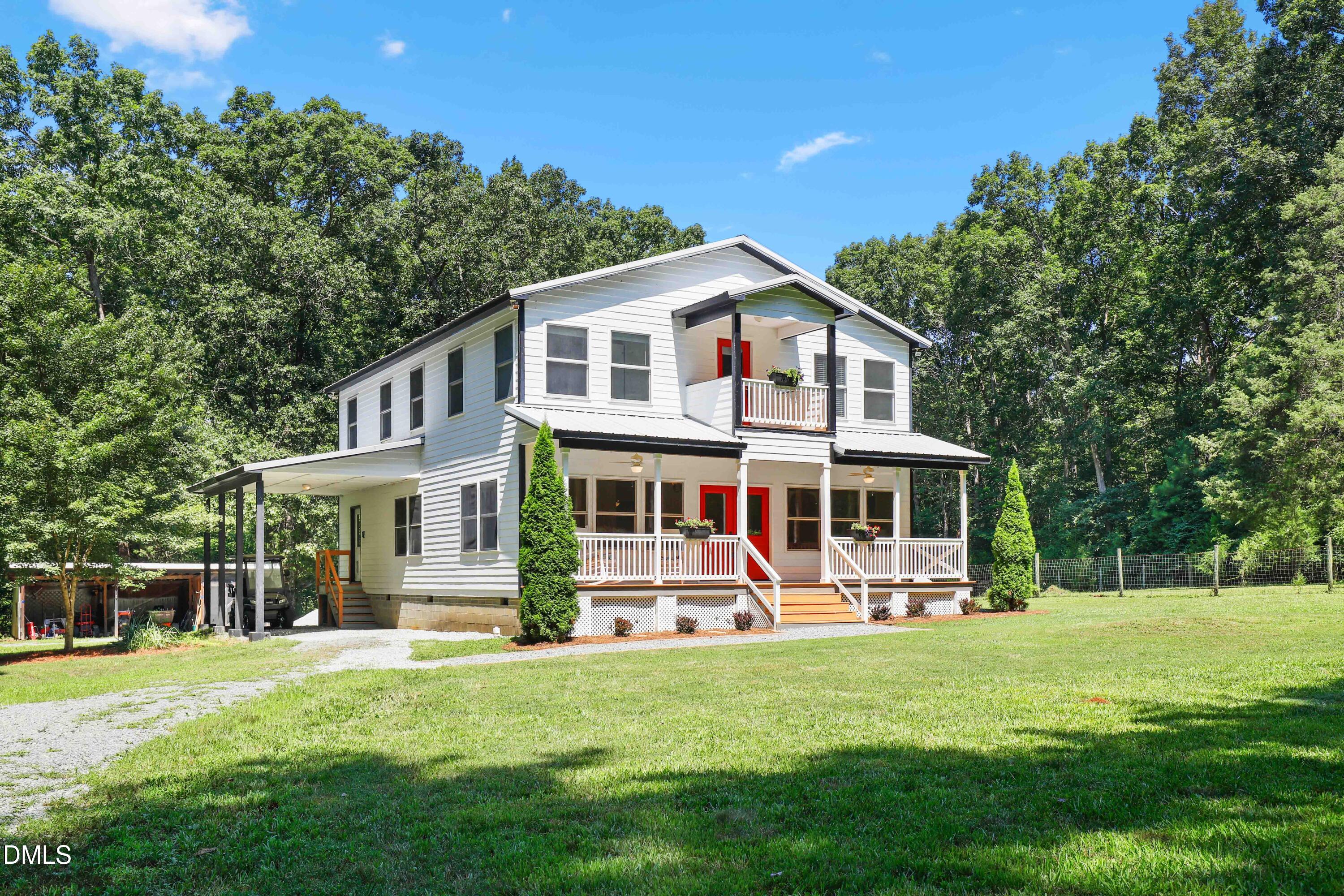 33 Holly Run Pittsboro, NC 27312 - Photo 42 of 46 a front view of a house with a yard table and chairs