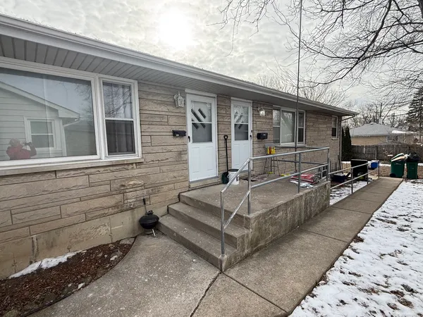 a view of house and patio with a yard