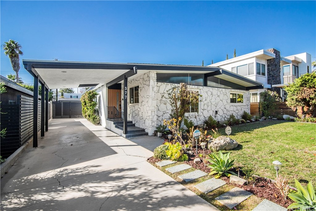377 Flint Avenue Long Beach, CA 90814 - Photo 2 of 41 a front view of a house with a yard
