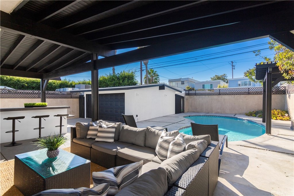 377 Flint Avenue Long Beach, CA 90814 - Photo 35 of 41 a outdoor living space with furniture and a fireplace