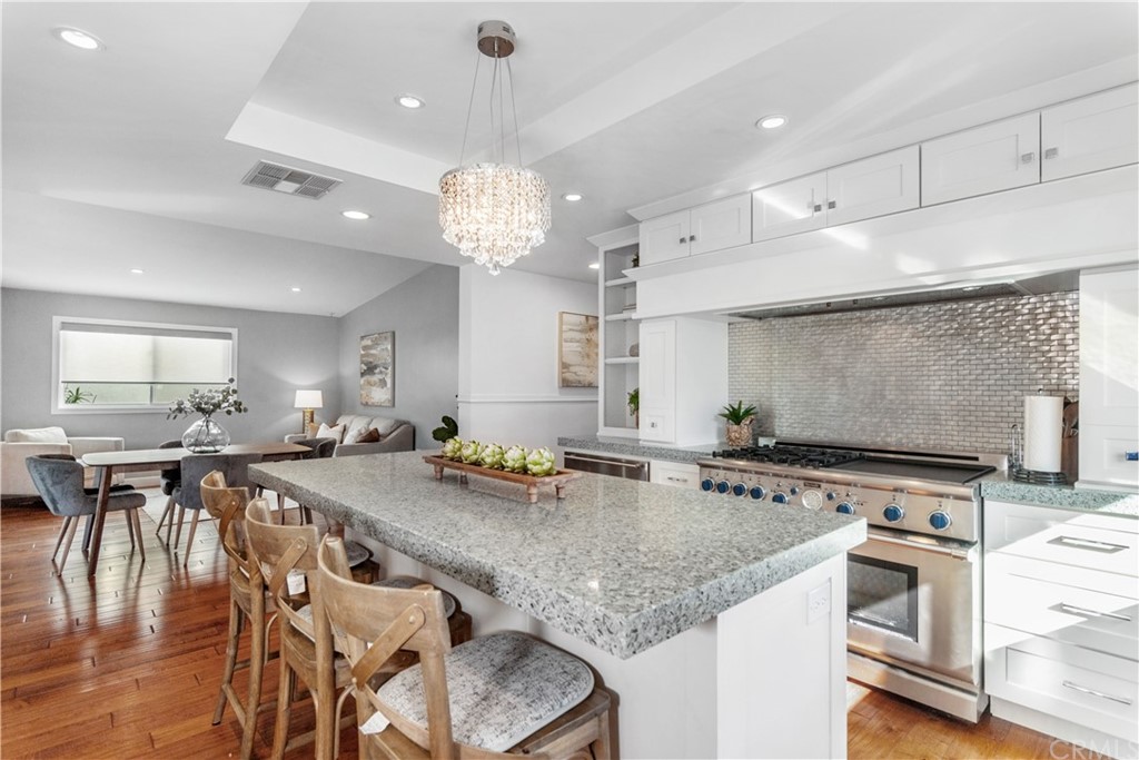 377 Flint Avenue Long Beach, CA 90814 - Photo 9 of 41 a large kitchen with a table and chairs