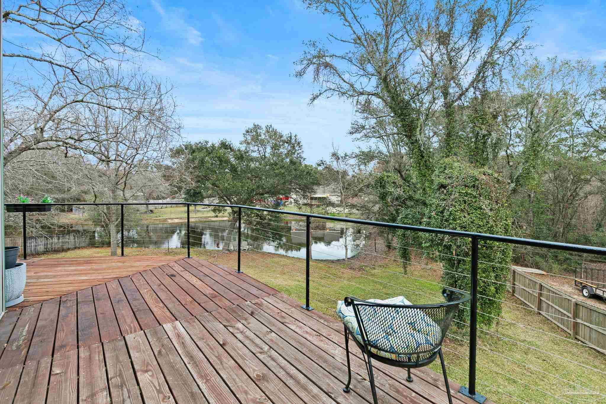 11424 High Springs Road Pensacola, FL 32534 - Photo 14 of 46 a view of balcony with wooden floor and outdoor seating
