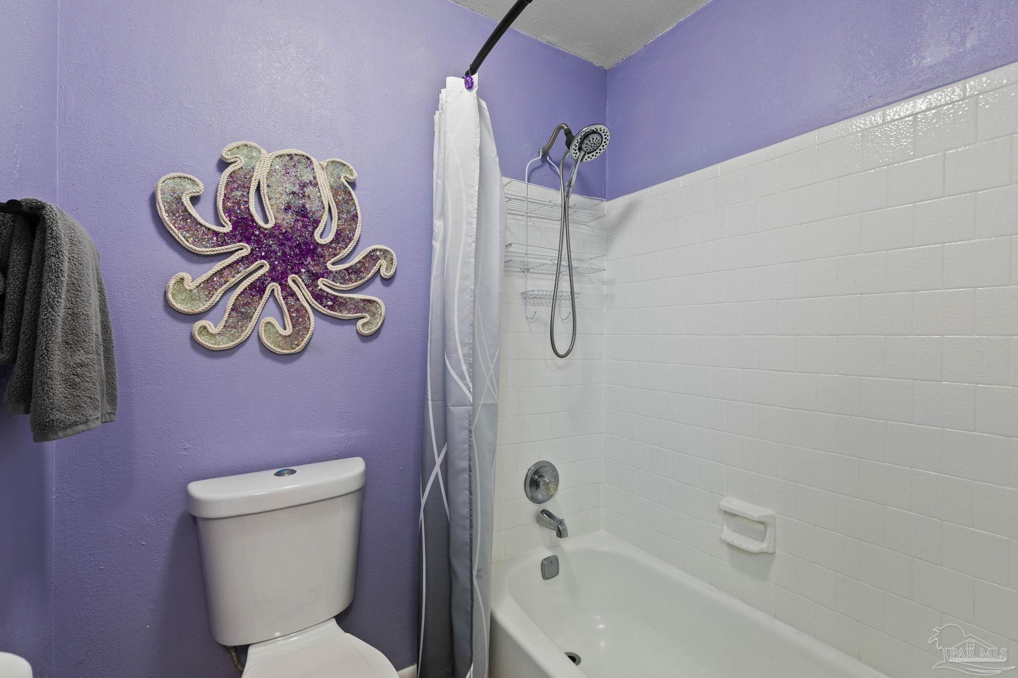 11424 High Springs Road Pensacola, FL 32534 - Photo 22 of 46 a bathroom with a shower a toilet and a shower