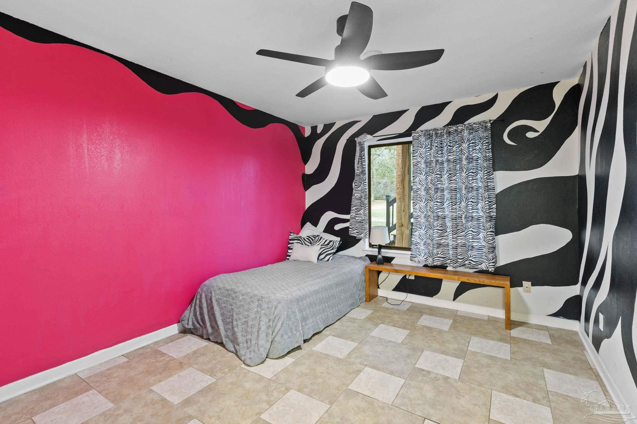 11424 High Springs Road Pensacola, FL 32534 - Photo 24 of 46 a bedroom with a bed and a mirror on dresser