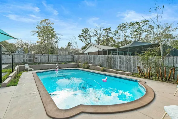 a view of a house with swimming pool