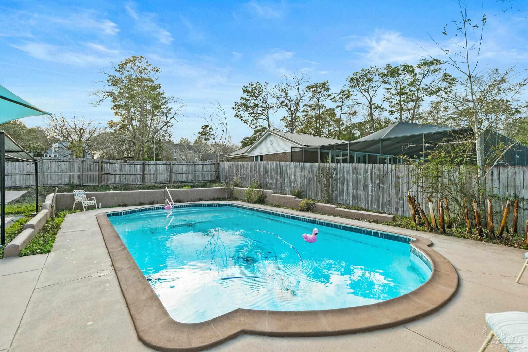 11424 High Springs Road Pensacola, FL 32534 - Photo 28 of 46 a view of a backyard with swimming pool