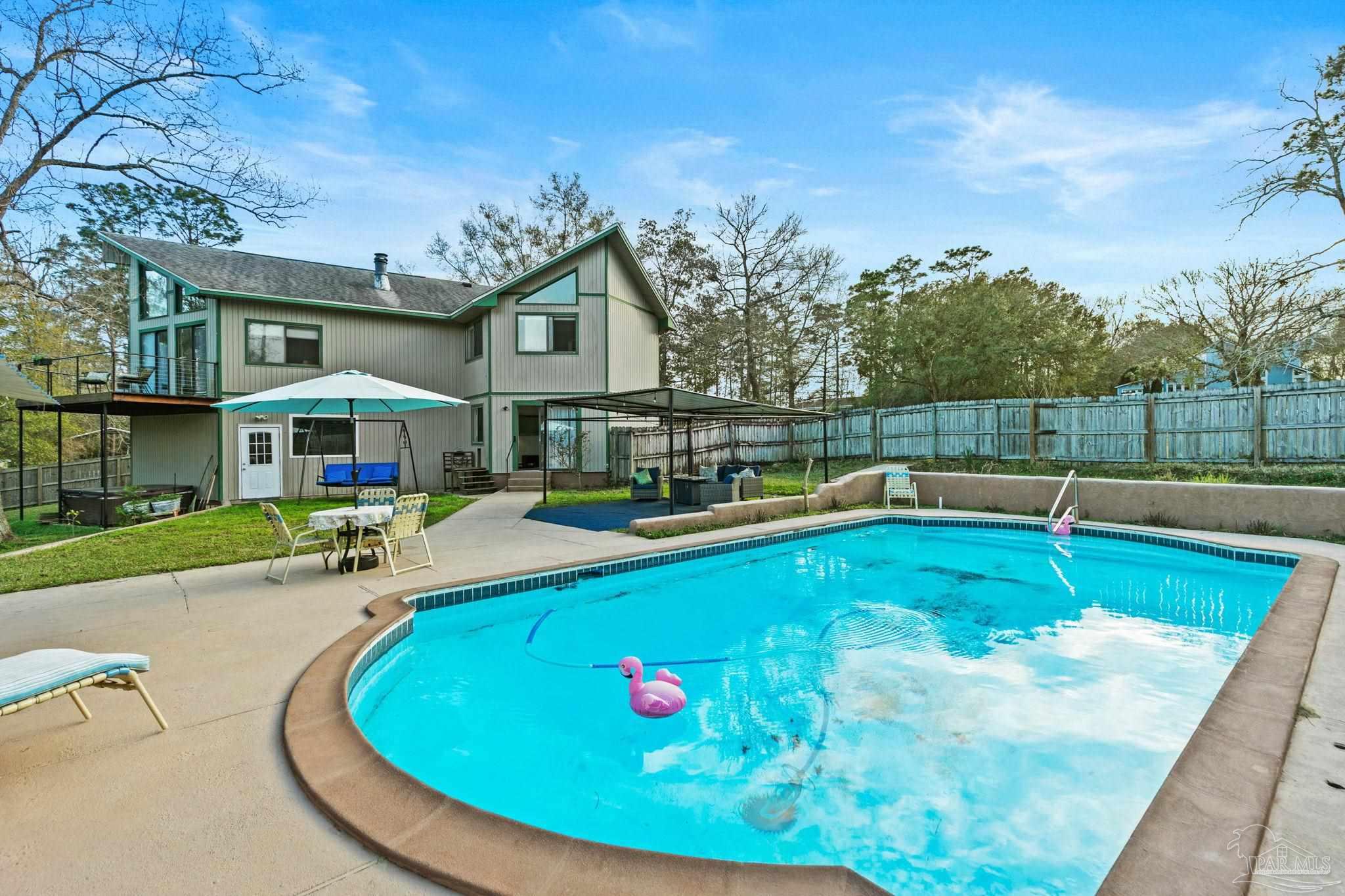 11424 High Springs Road Pensacola, FL 32534 - Photo 29 of 46 a view of a house with swimming pool