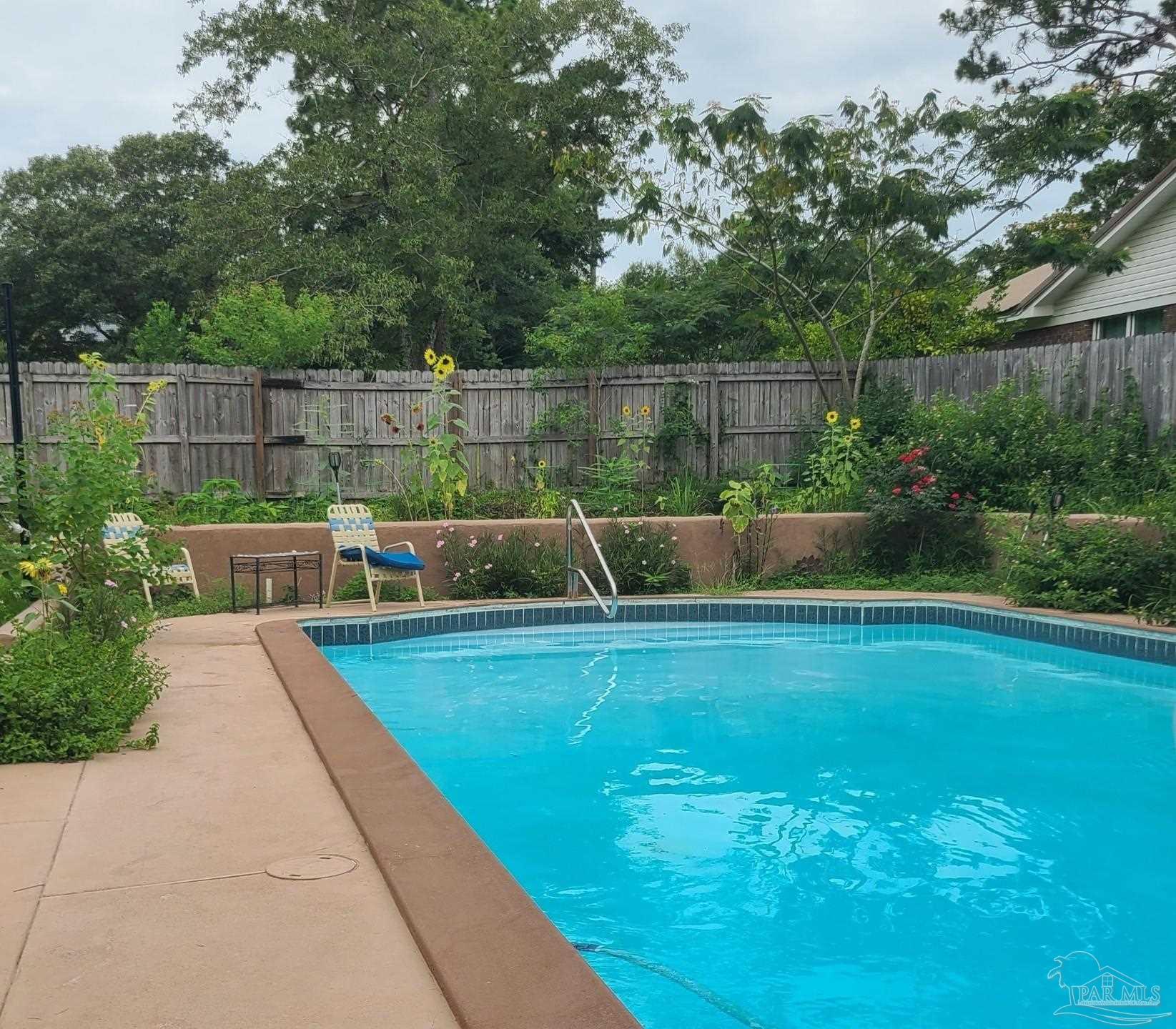11424 High Springs Road Pensacola, FL 32534 - Photo 31 of 46 a view of a backyard with a garden