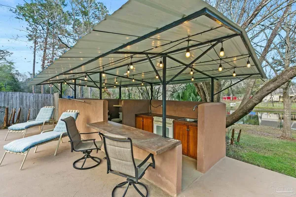 a view of a backyard with sitting area