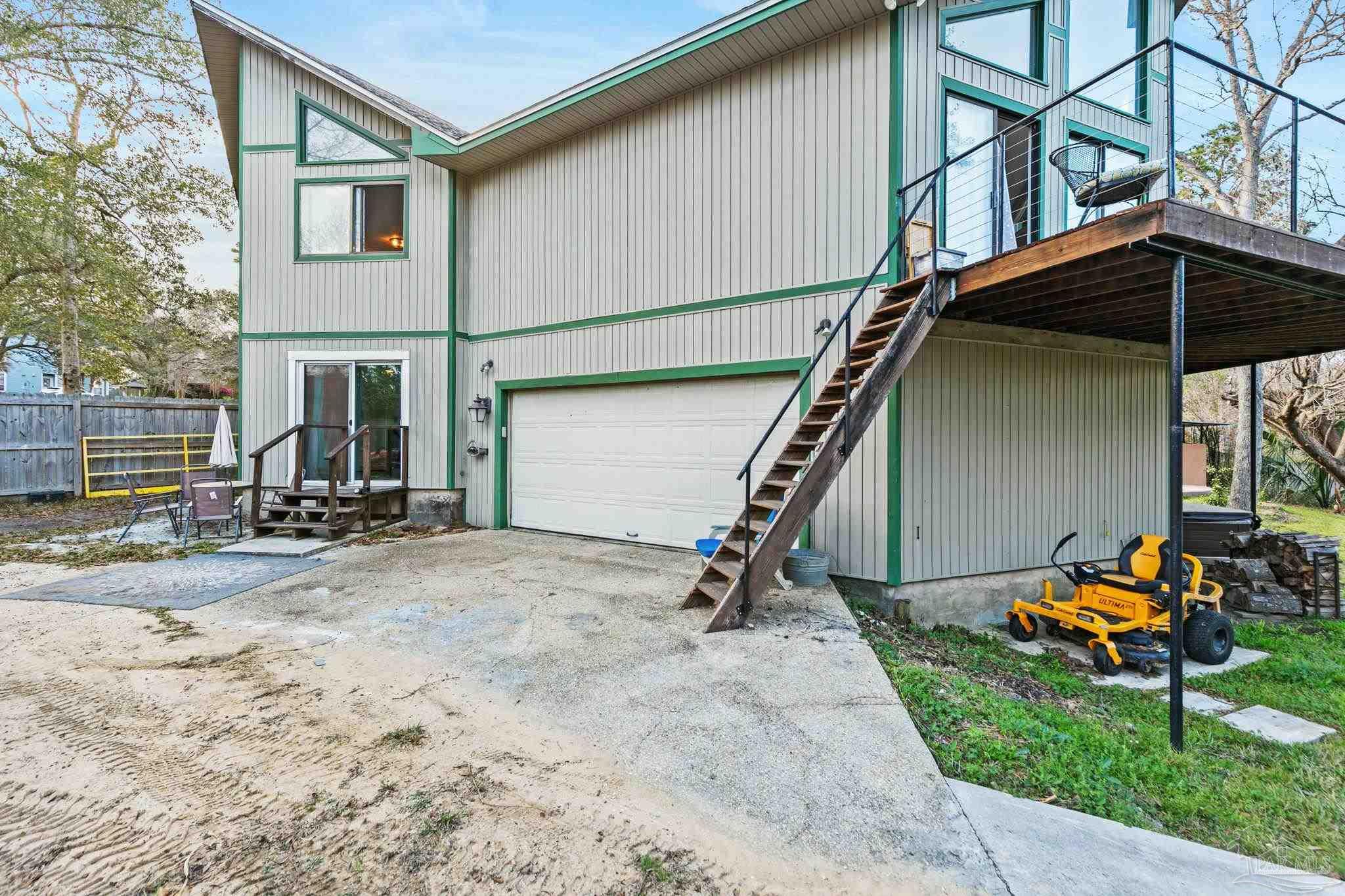 11424 High Springs Road Pensacola, FL 32534 - Photo 40 of 46 a view of a house with backyard and chairs