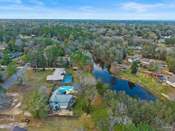 an aerial view of a house with outdoor space