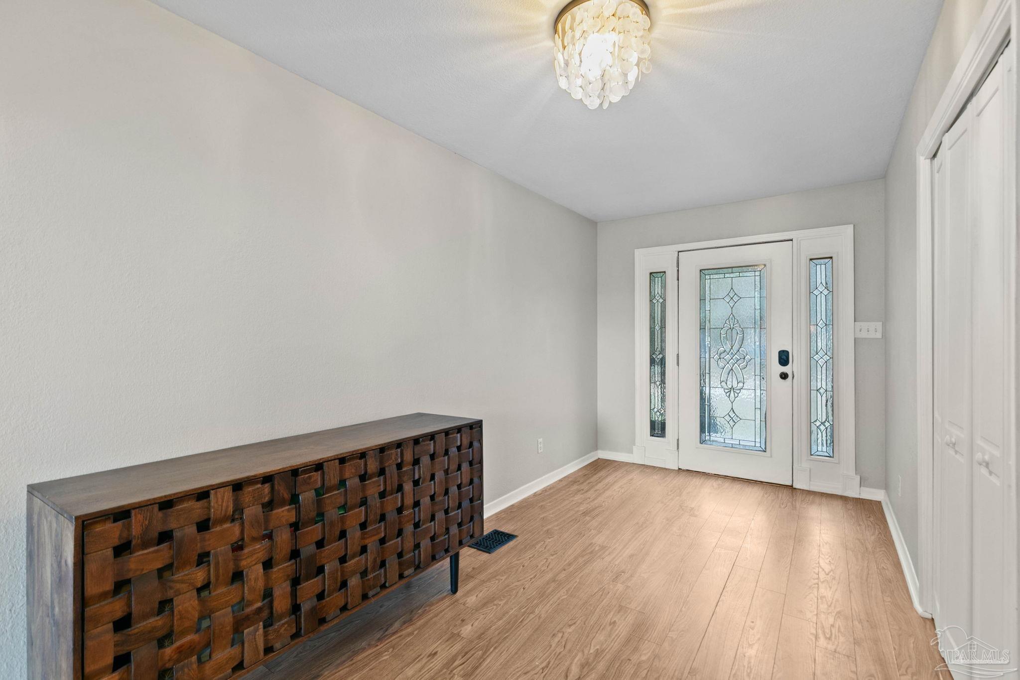 11424 High Springs Road Pensacola, FL 32534 - Photo 5 of 46 a view of a hallway with wooden floor