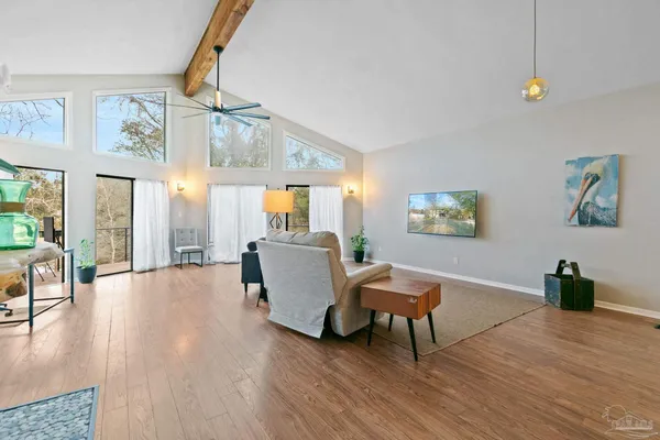 a living room with furniture and a large window