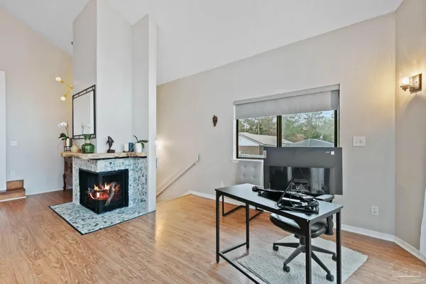 a dining room with furniture and window