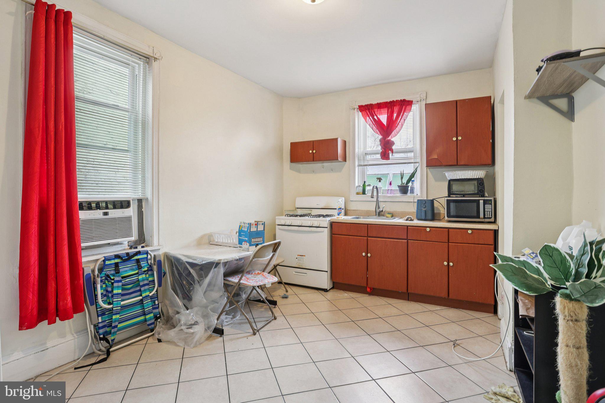 115 North Peach Street Philadelphia, PA 19139 - Photo 15 of 19 a room with furniture a rug and a window
