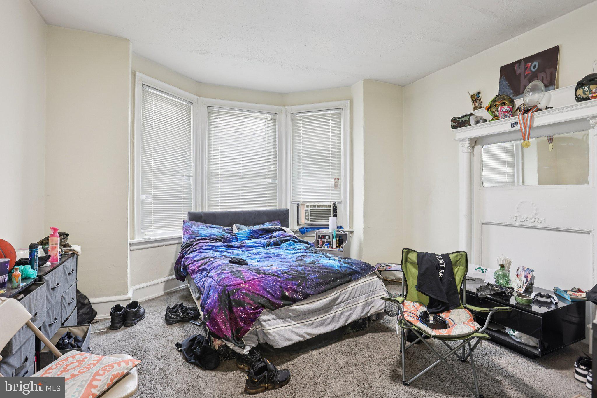 115 North Peach Street Philadelphia, PA 19139 - Photo 16 of 19 a bedroom with a bed and wooden floor