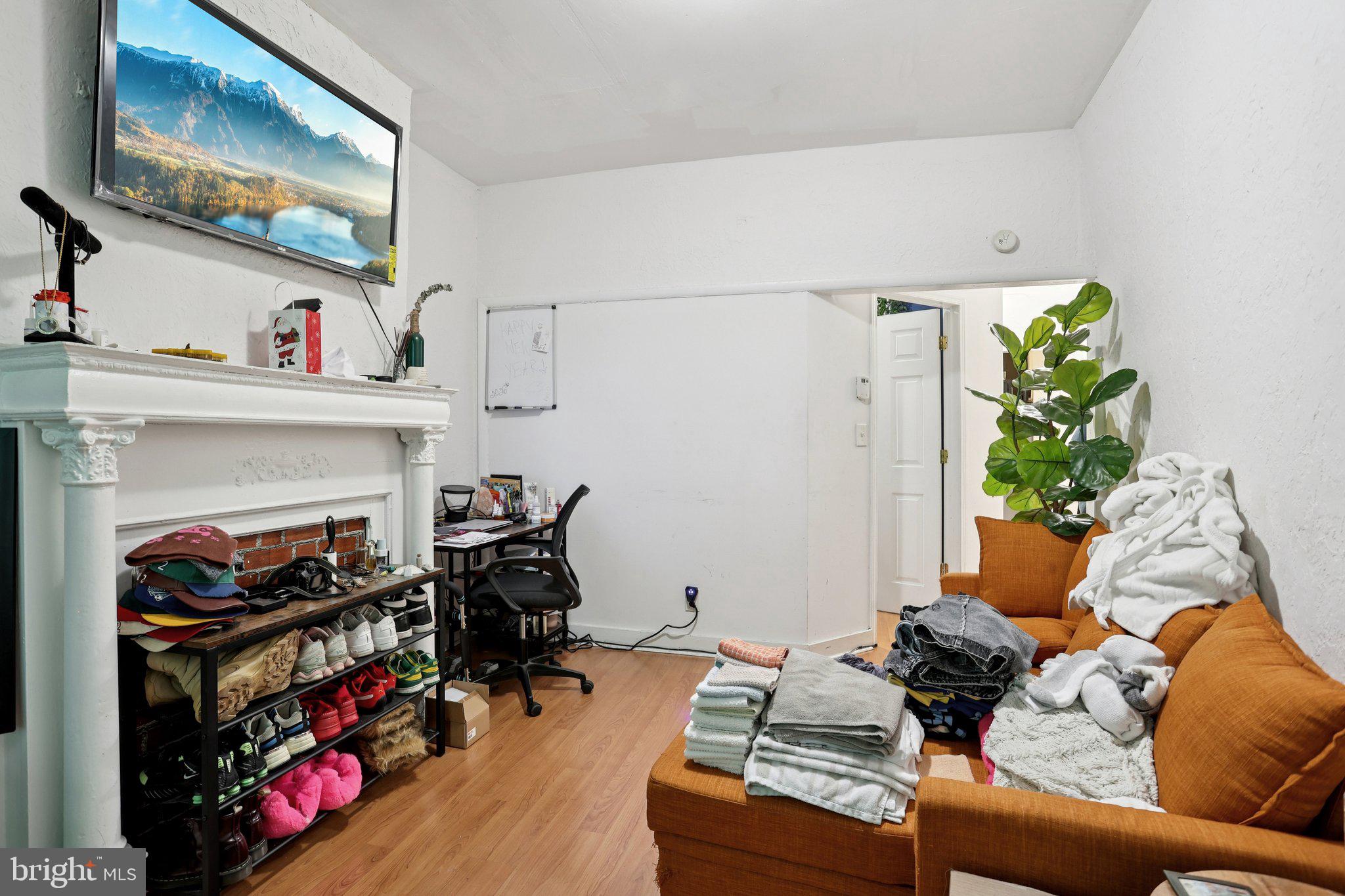 115 North Peach Street Philadelphia, PA 19139 - Photo 3 of 19 a living room with furniture and a fireplace