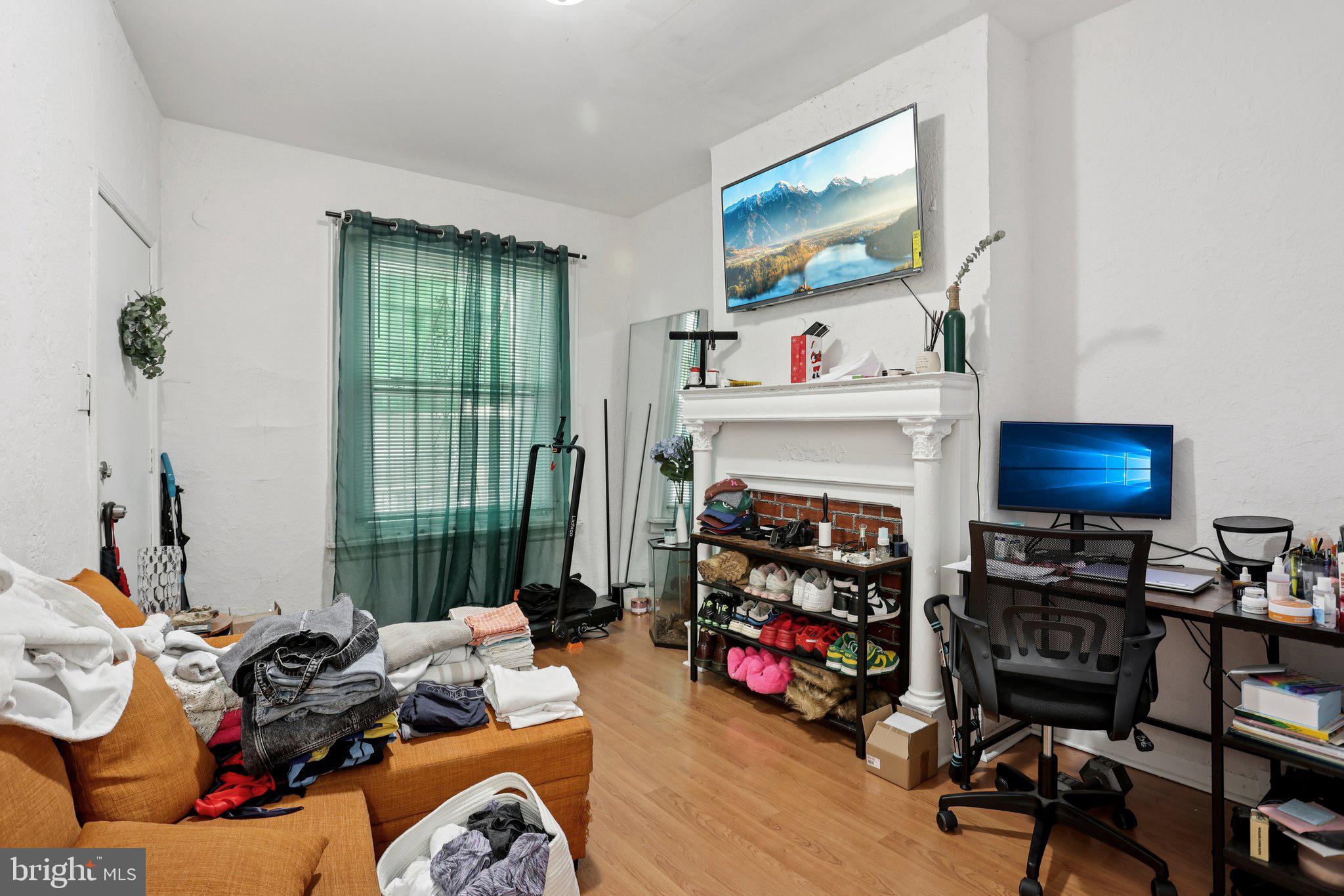 115 North Peach Street Philadelphia, PA 19139 - Photo 4 of 19 a view of a livingroom with furniture and a flat screen tv