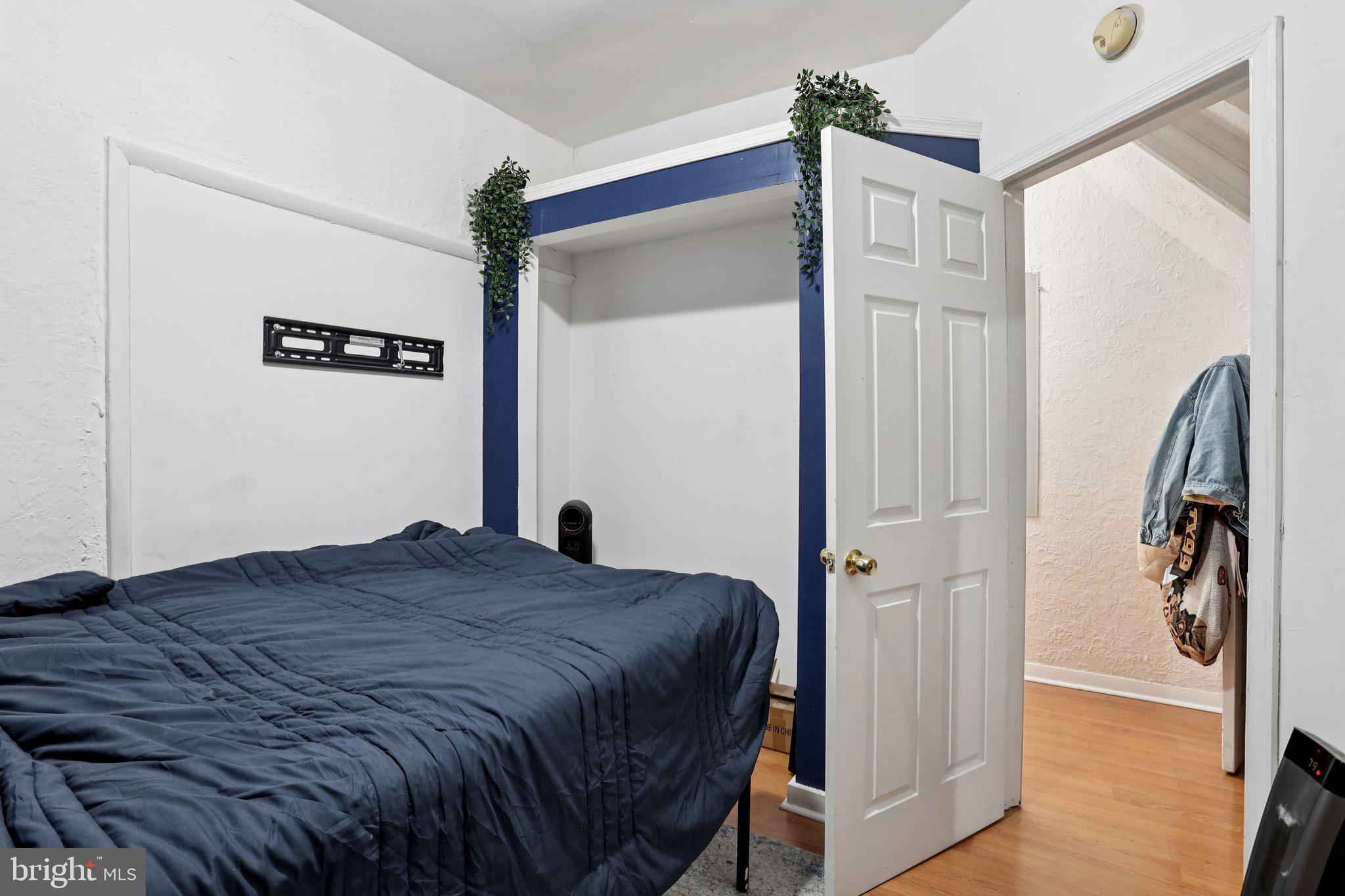 115 North Peach Street Philadelphia, PA 19139 - Photo 8 of 19 a bedroom with a bed and a walk in closet