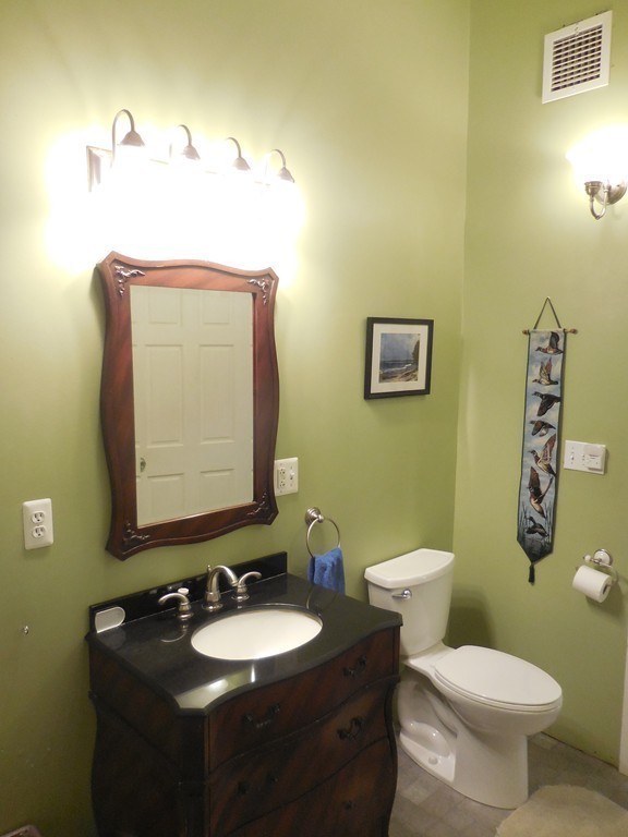 123 Pleasant Valley Road Amesbury, MA 01913 - Photo 19 of 30 a bathroom with a toilet sink and mirror