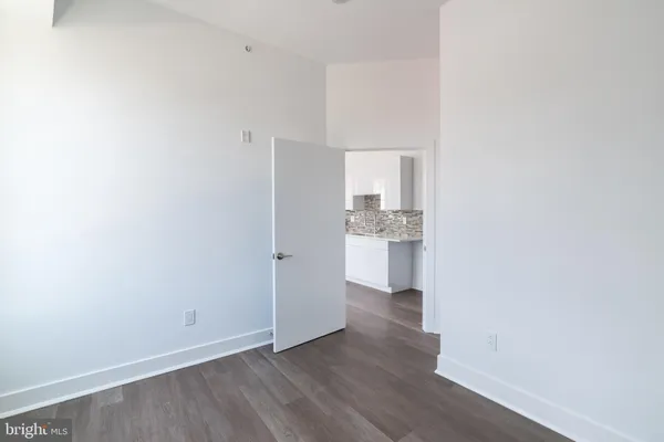 a view of a kitchen with wooden floor