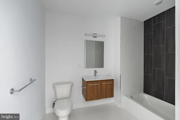 a bathroom with a toilet sink and shower