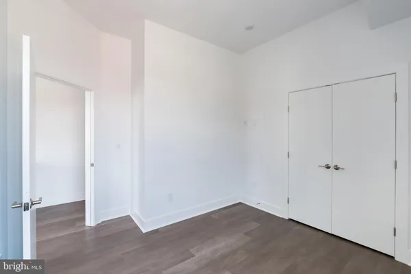 an empty room with wooden floor