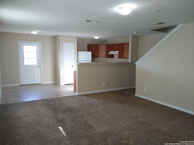 a kitchen with a refrigerator a stove top oven a sink and dishwasher