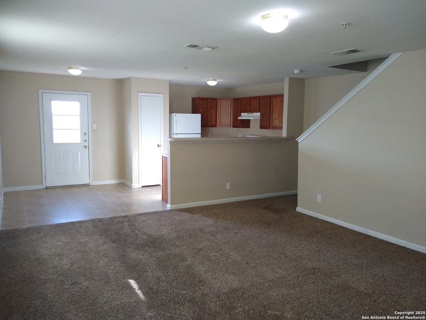 10010 Vasso View, Unit 1 Converse, TX 78109 - Photo 3 of 6 a view of a kitchen with a sink
