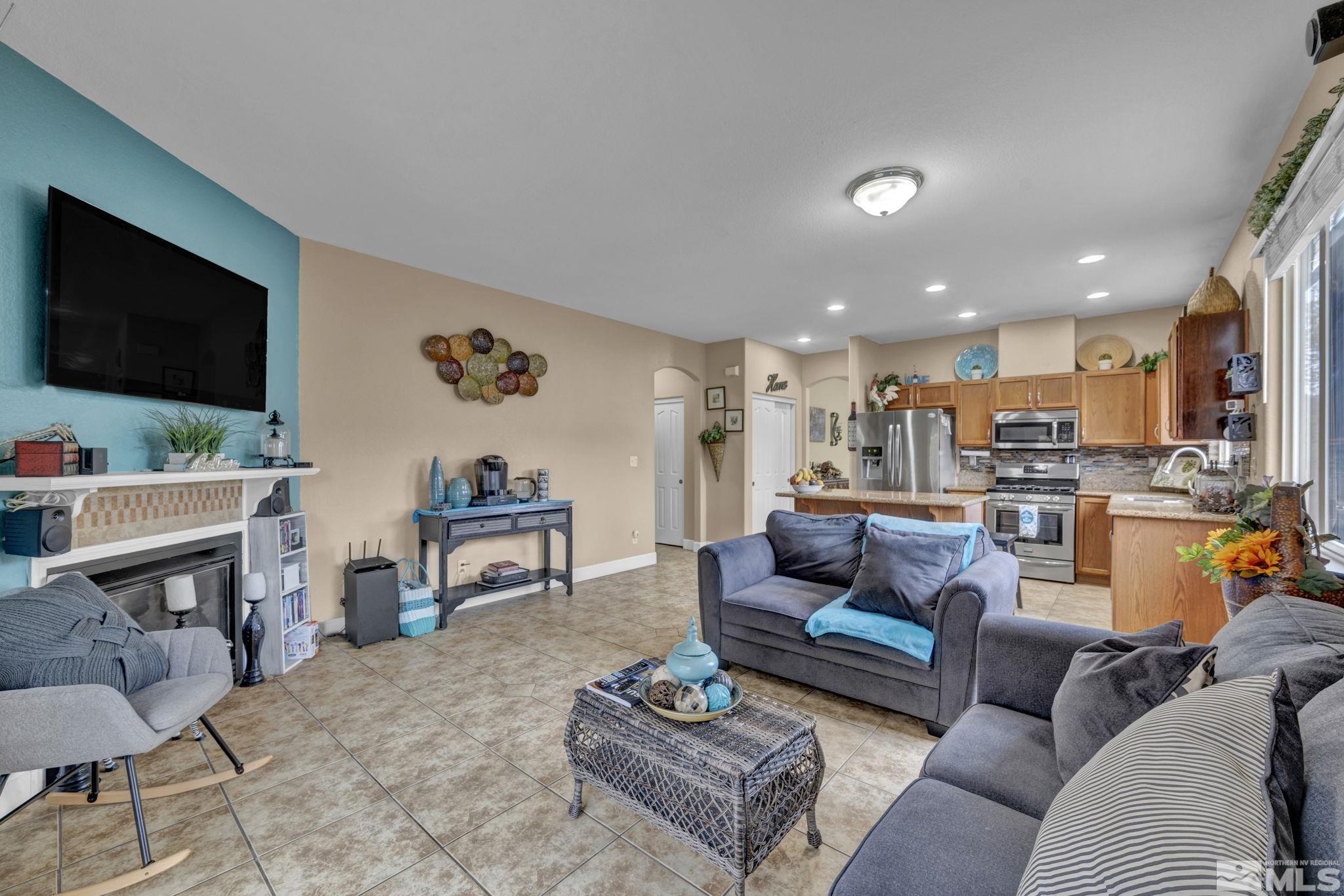 2721 Harding Way Reno, NV 89503 - Photo 11 of 40 a living room with furniture and a flat screen tv