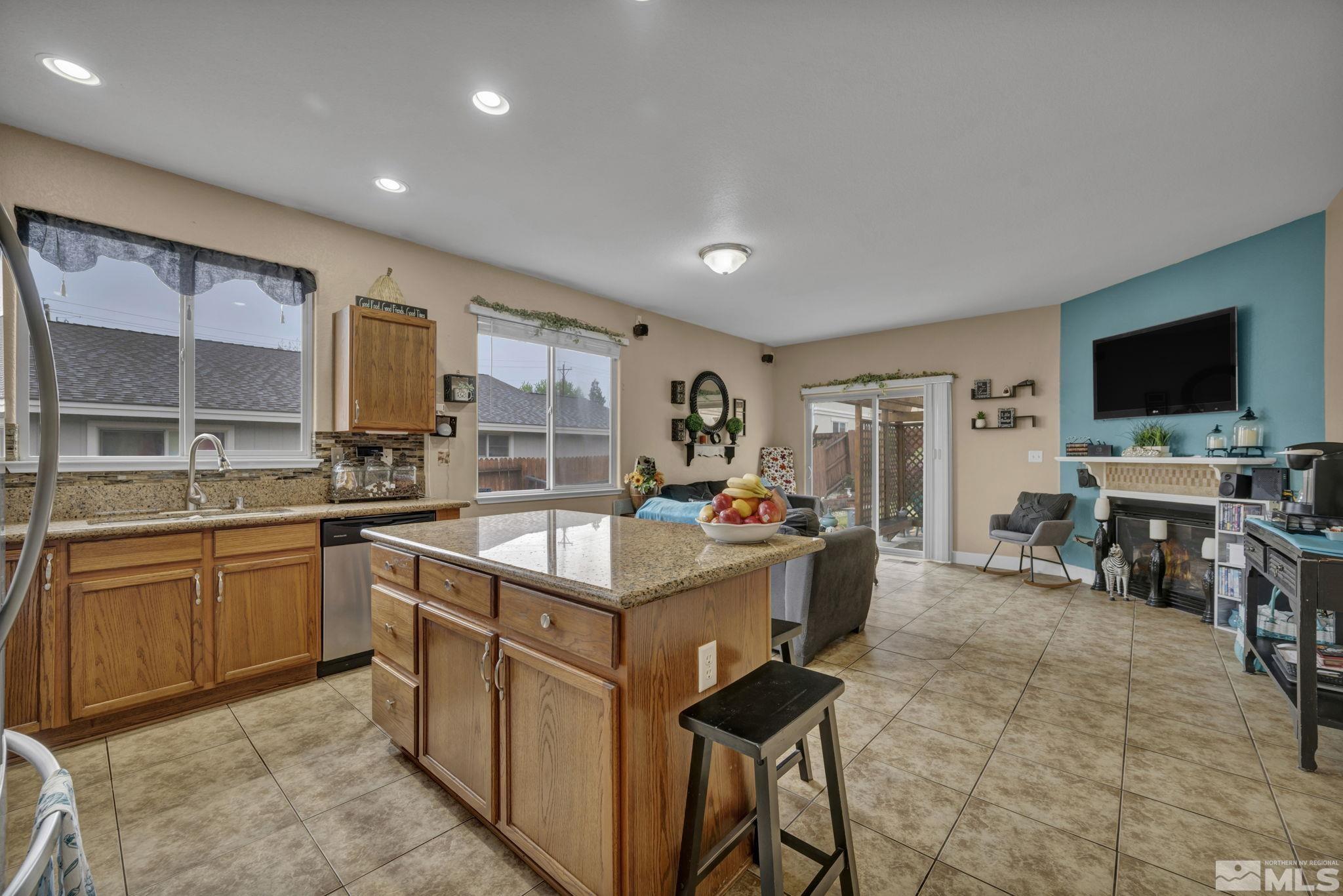 2721 Harding Way Reno, NV 89503 - Photo 14 of 40 a kitchen that has a lot of cabinets in it and appliances