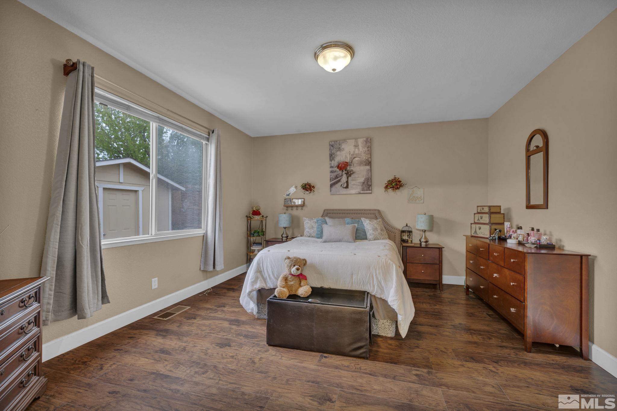 2721 Harding Way Reno, NV 89503 - Photo 18 of 40 a bedroom with a bed and window