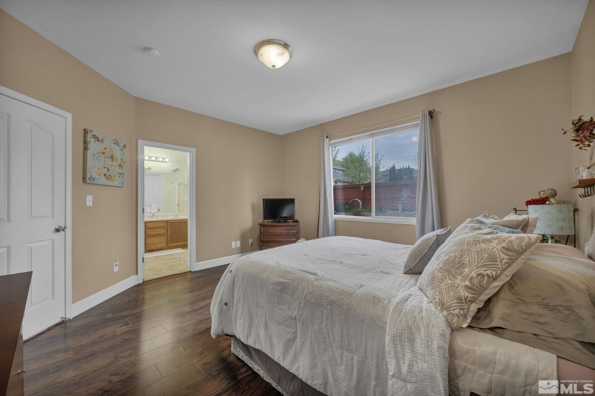 2721 Harding Way Reno, NV 89503 - Photo 19 of 40 a bedroom with a bed and a window