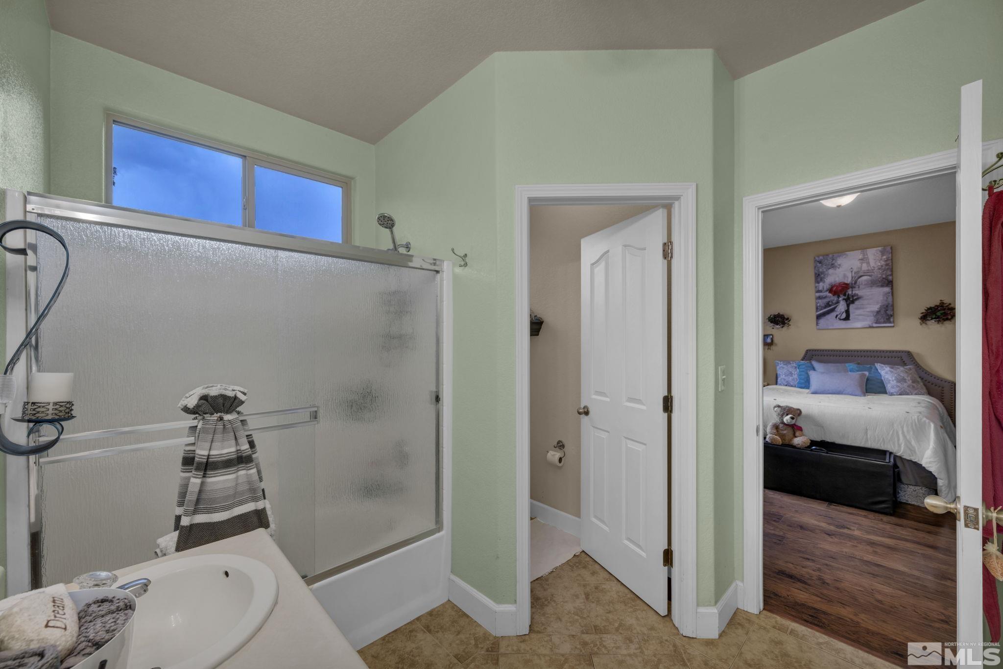 2721 Harding Way Reno, NV 89503 - Photo 21 of 40 a bathroom with a toilet and a shower