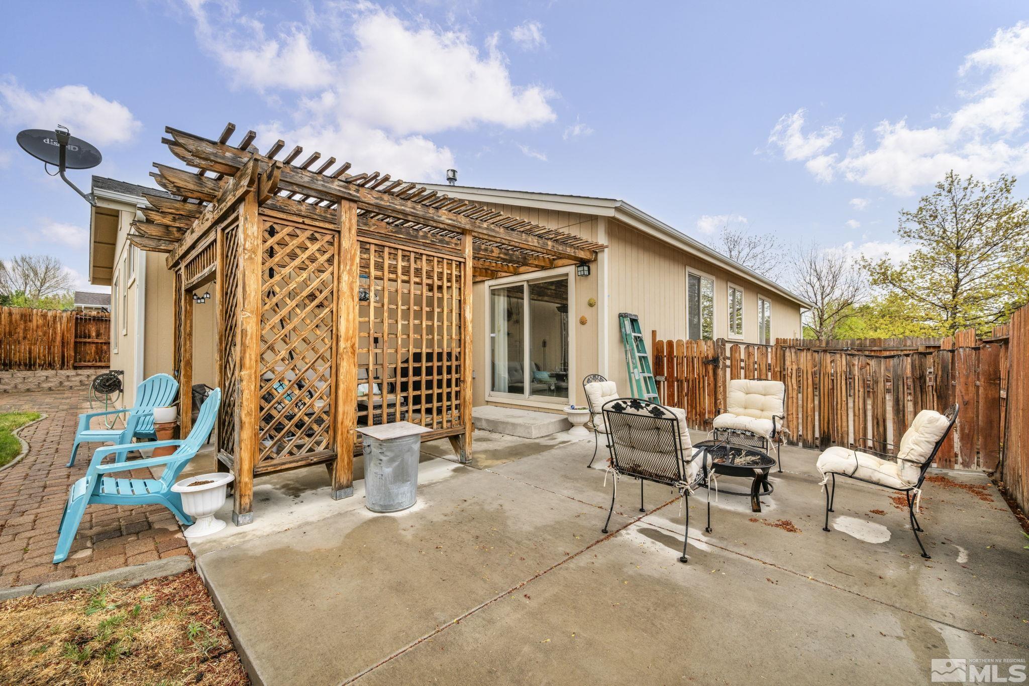 2721 Harding Way Reno, NV 89503 - Photo 32 of 40 a view of a chair and tables in patio of the house