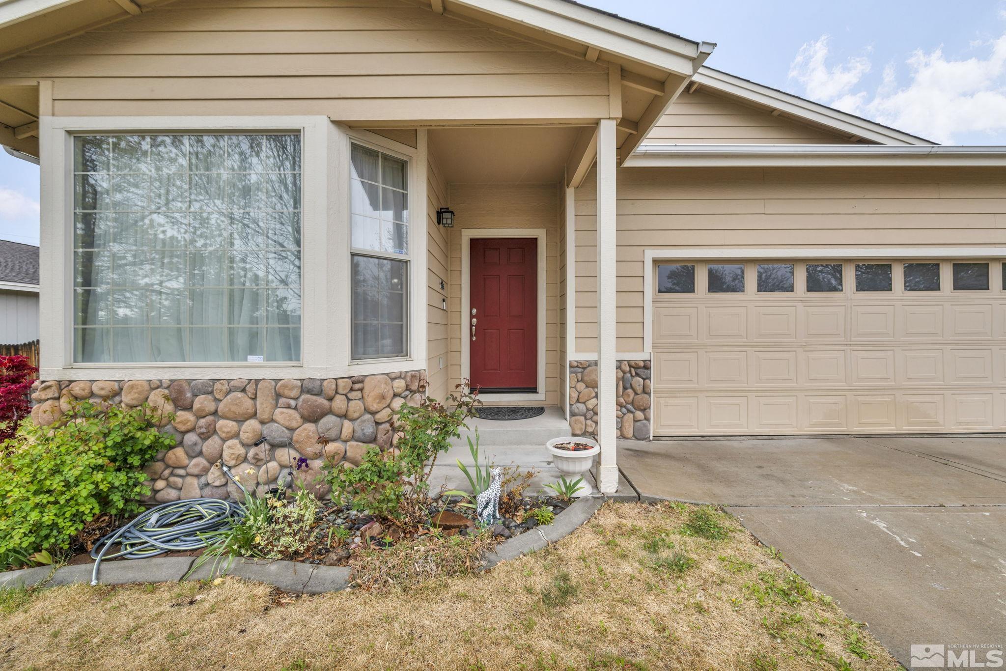 2721 Harding Way Reno, NV 89503 - Photo 4 of 40 a front view of a house with garden