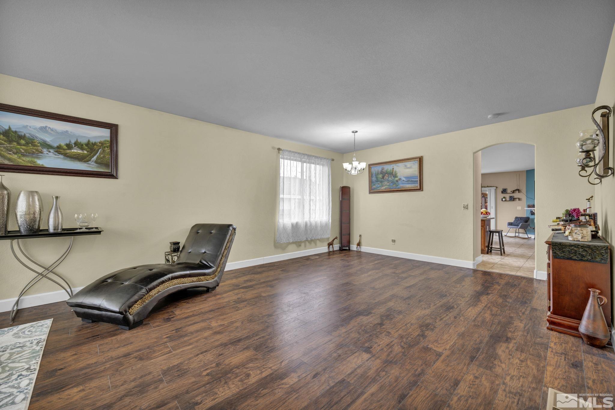 2721 Harding Way Reno, NV 89503 - Photo 7 of 40 a view of room with wooden floor and furniture