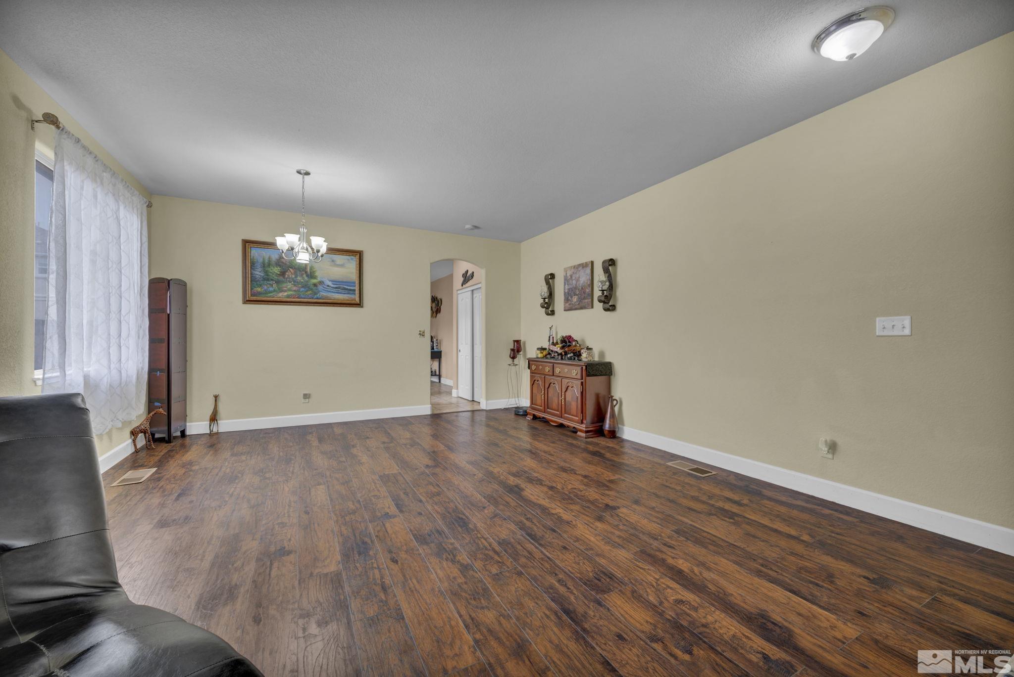 2721 Harding Way Reno, NV 89503 - Photo 8 of 40 a view of a livingroom with wooden floor and window
