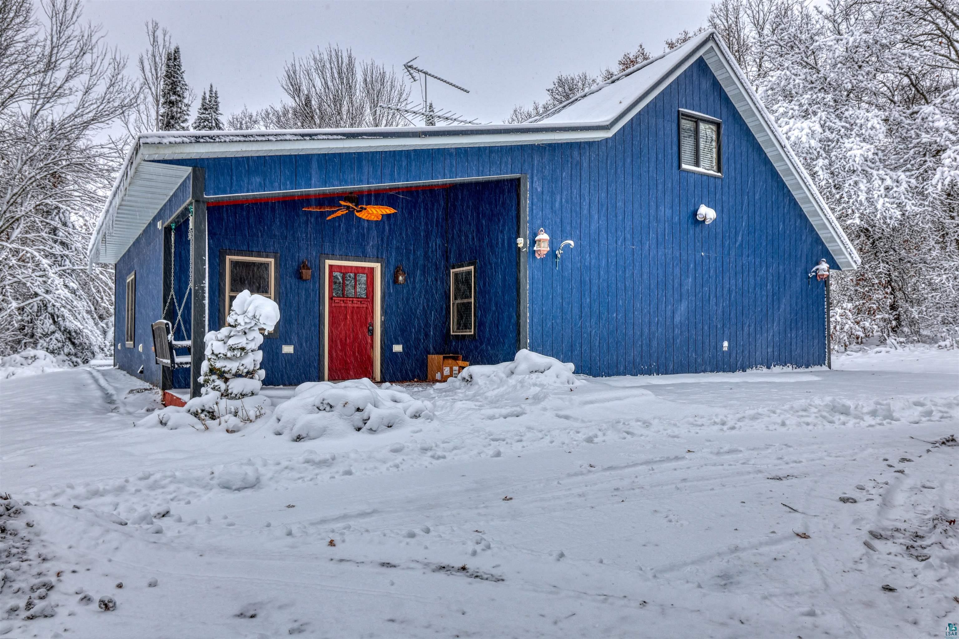 View of front of house with a ceiling fan