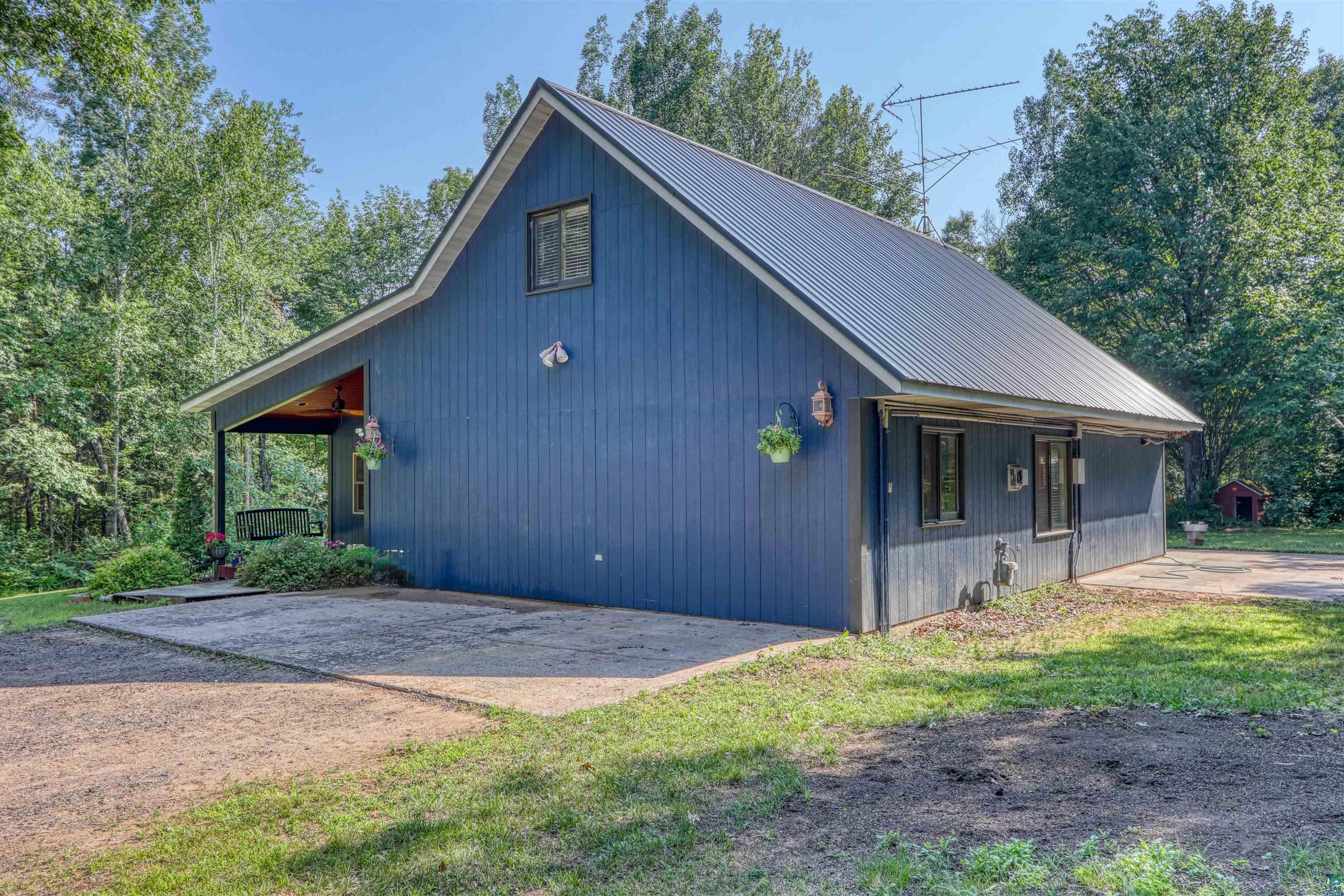 15531 West Hospital Road Hayward, WI 54843 - Photo 12 of 71 View of property exterior with a metal roof